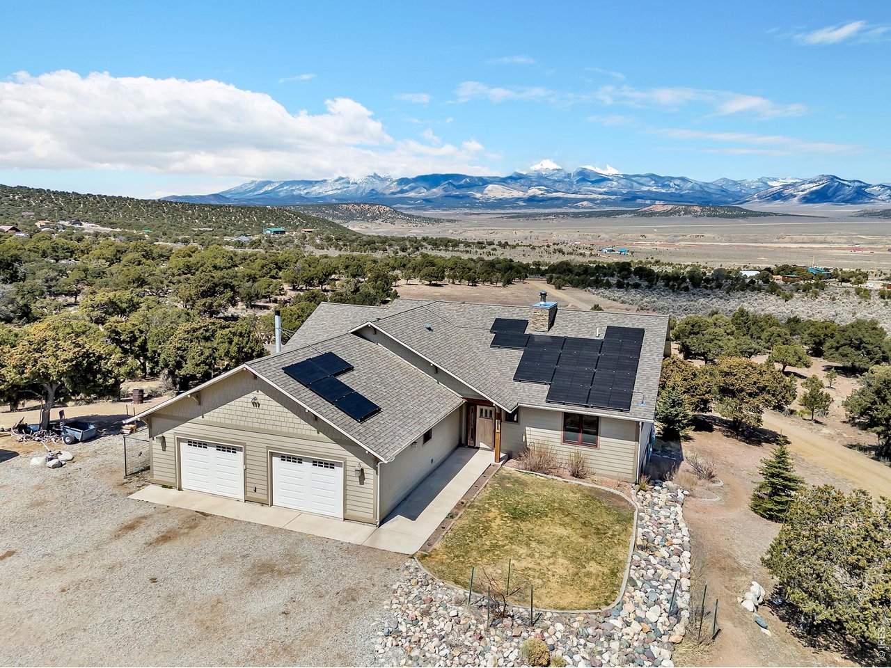 an aerial view of a house with a ocean view