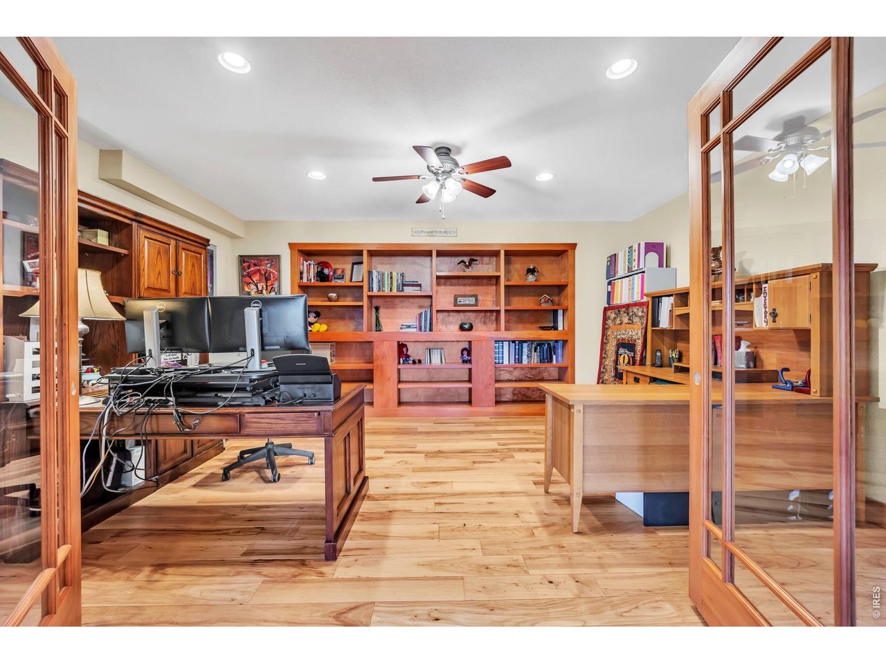 3237 Romnes Road Fort Garland, CO 81133 - Photo 21 of 42 a living room with furniture a flat screen tv and a floor to ceiling window
