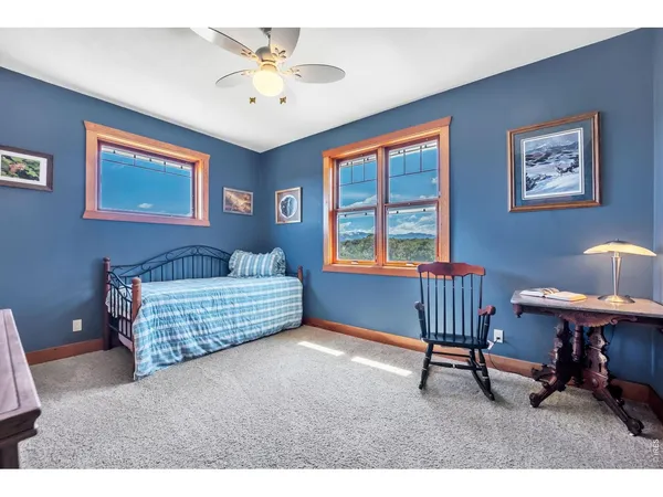 a bedroom with furniture and a window