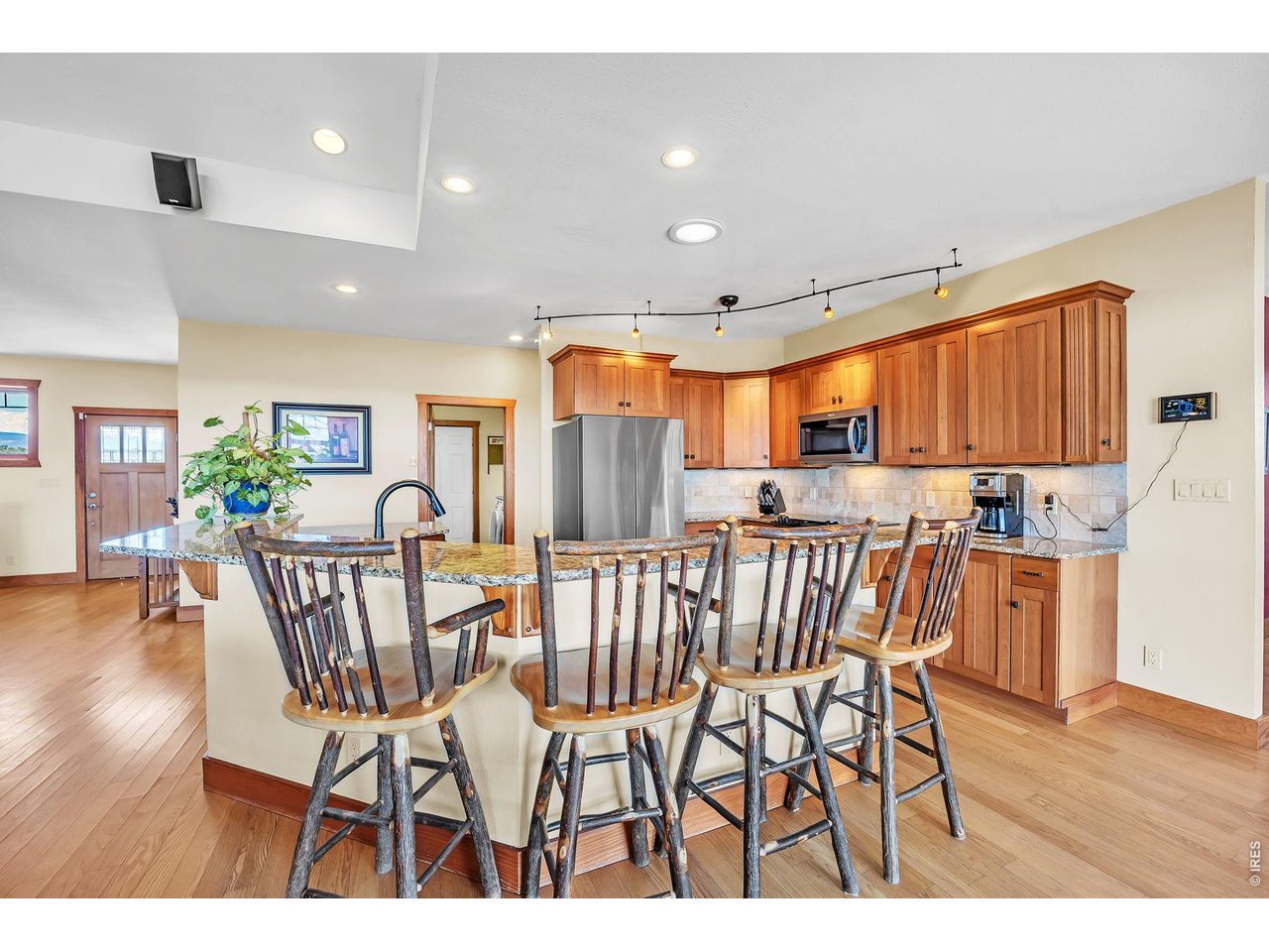 3237 Romnes Road Fort Garland, CO 81133 - Photo 33 of 42 a view of a dining room with furniture and wooden floor