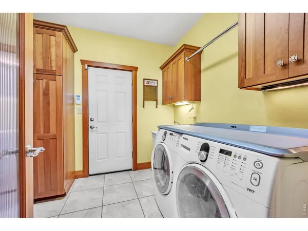 a view of a kitchen with washer and dryer