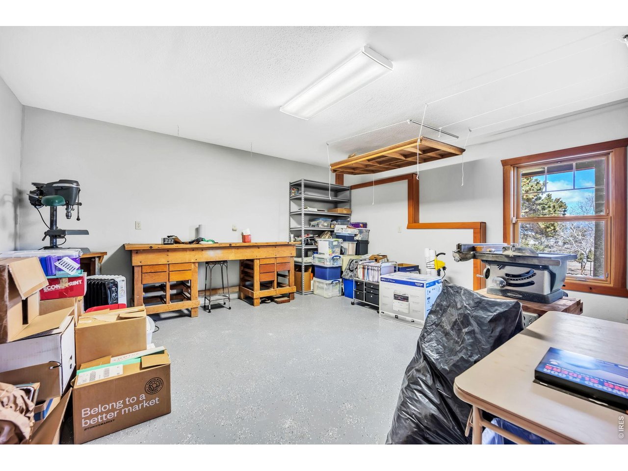 3237 Romnes Road Fort Garland, CO 81133 - Photo 37 of 42 a living room with lots of furniture and a flat screen tv