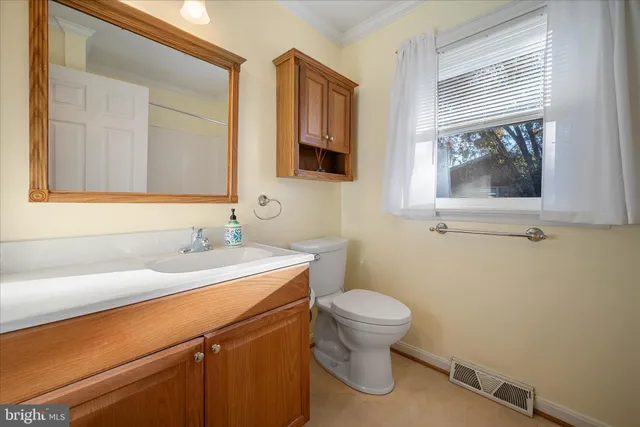 a bathroom with a bath tub with a shower