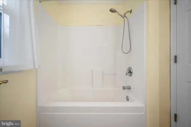 a view of entryway with wooden floor and staircase