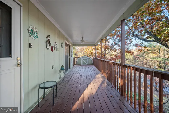 a view of a balcony with wooden floor
