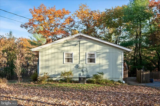 an aerial view of a houses with a lake view