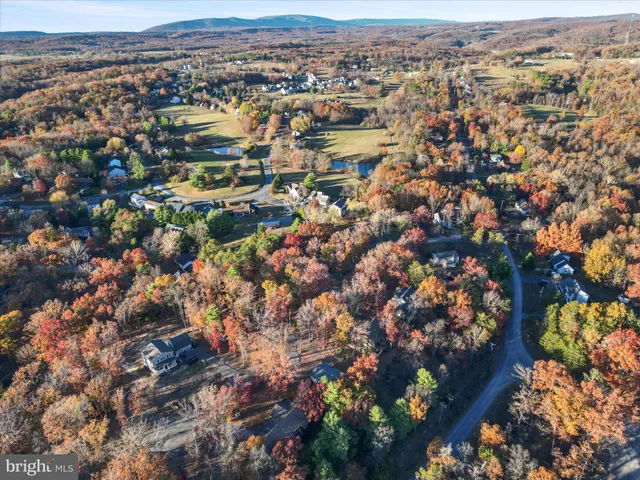 an aerial view of a house with a lake view