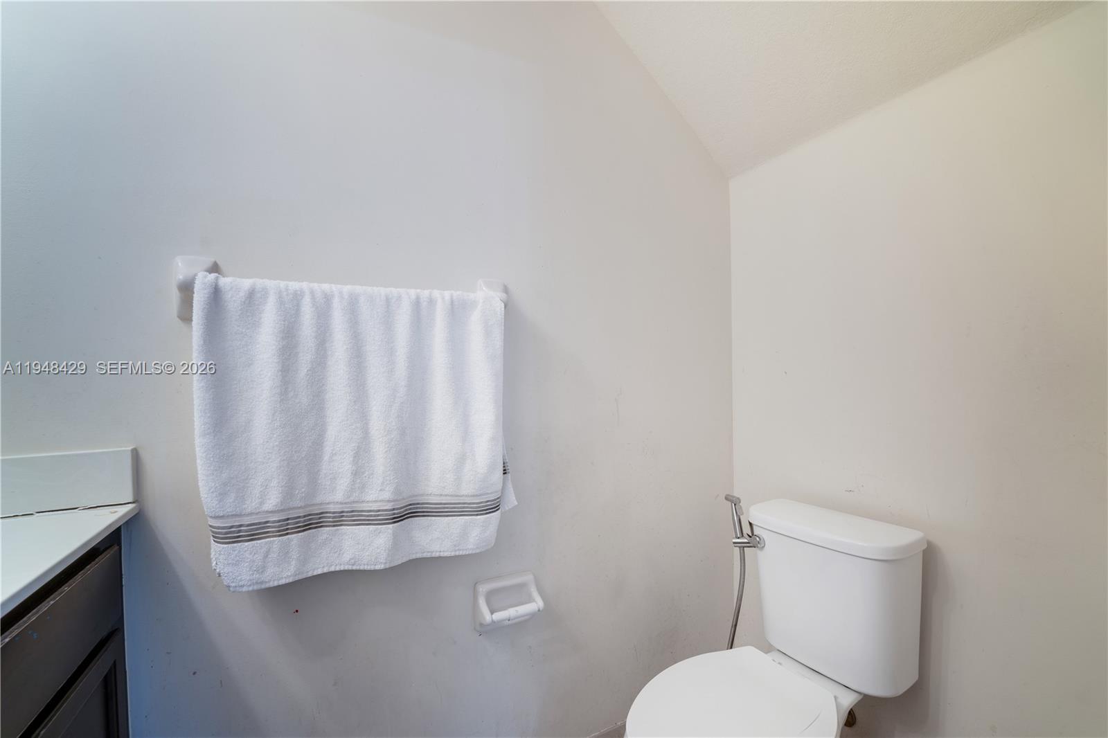 9360 Southwest 171st Court Miami, FL 33196 - Photo 12 of 43 a bathroom with a toilet and a sink