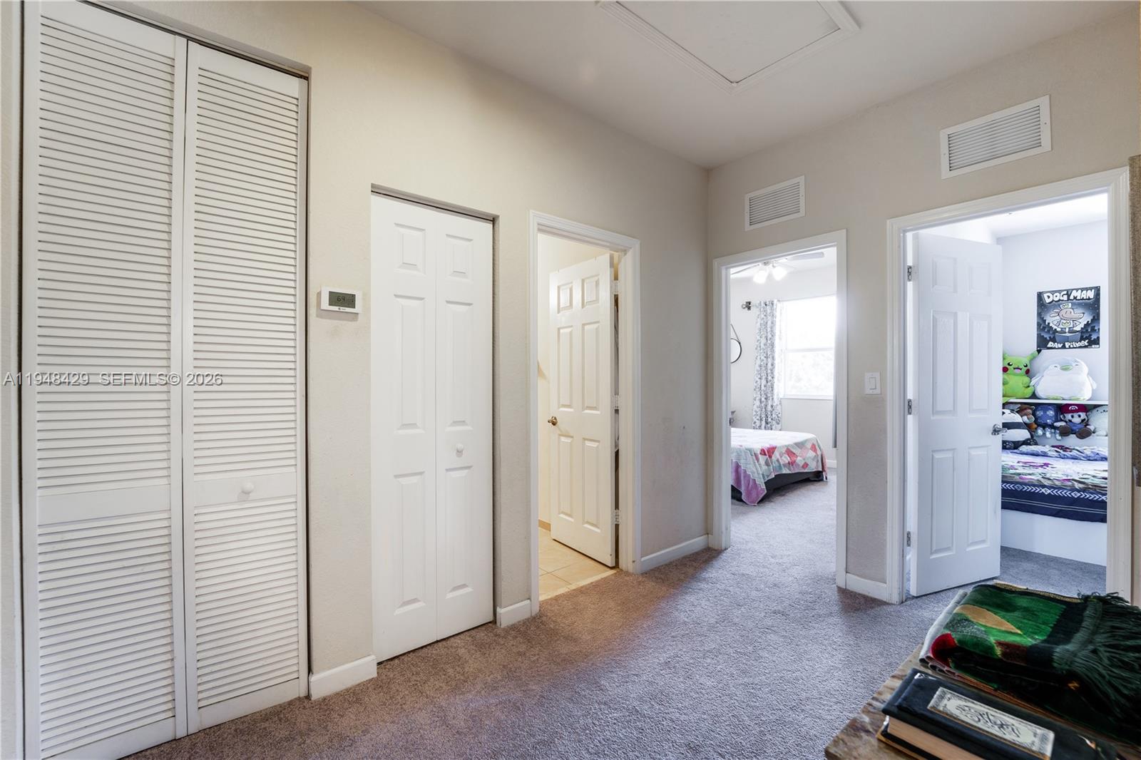 9360 Southwest 171st Court Miami, FL 33196 - Photo 18 of 43 a view of a livingroom with furniture and a hallway