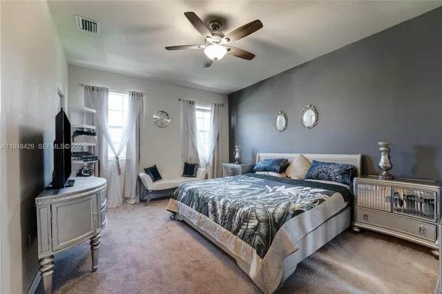 a bedroom with bed and window