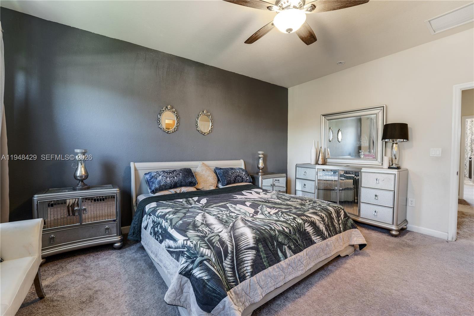 9360 Southwest 171st Court Miami, FL 33196 - Photo 21 of 43 a bedroom with bed and window