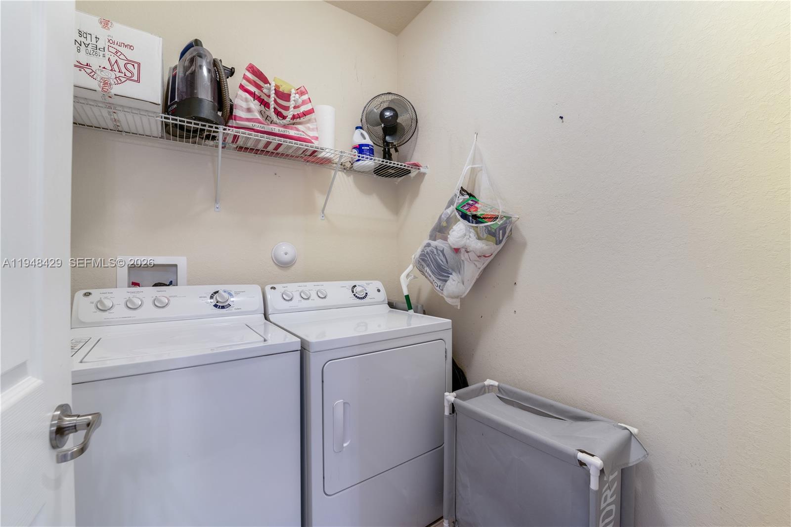 9360 Southwest 171st Court Miami, FL 33196 - Photo 26 of 43 a utility room with dryer and washer