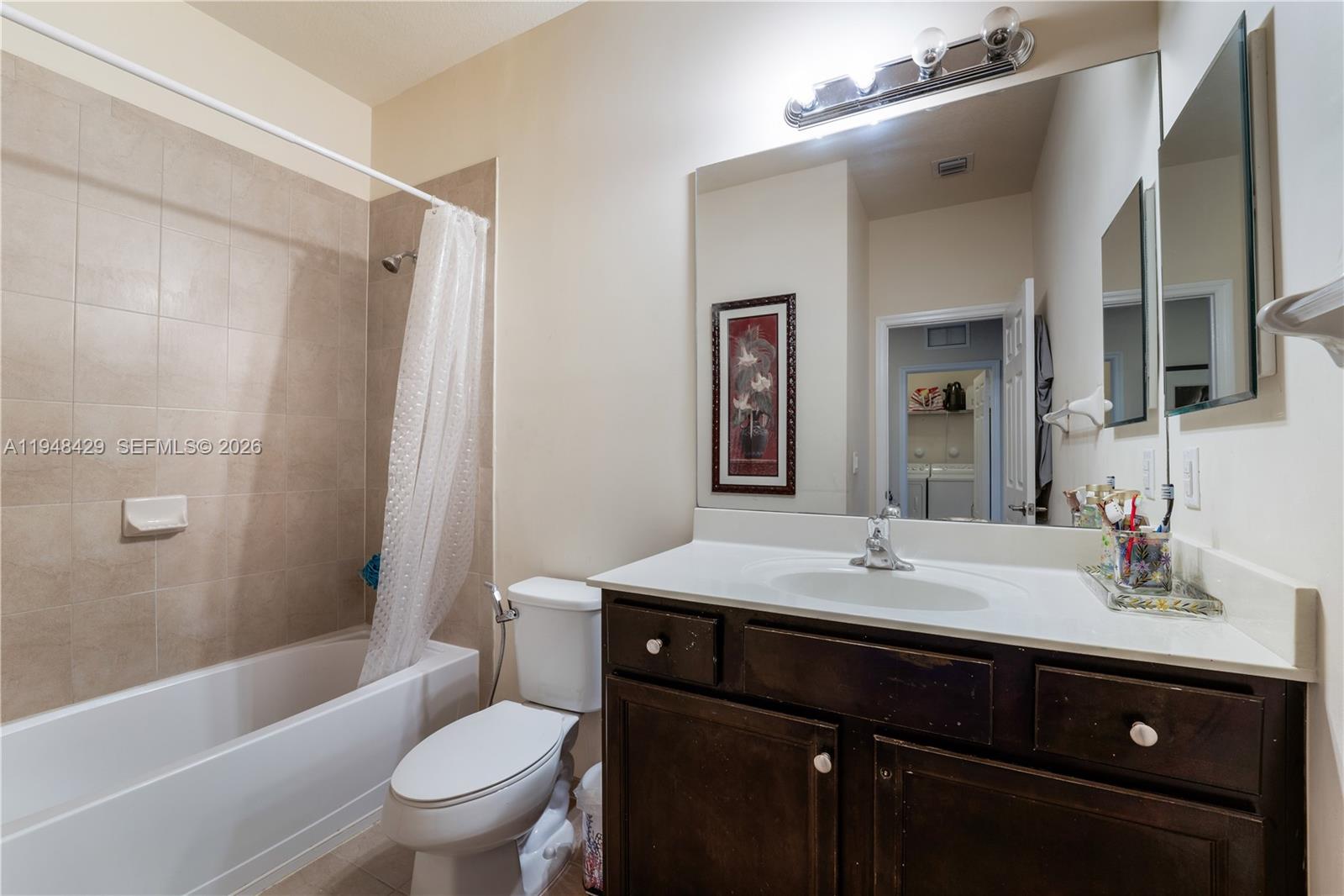 9360 Southwest 171st Court Miami, FL 33196 - Photo 30 of 43 a bathroom with a sink a toilet and shower