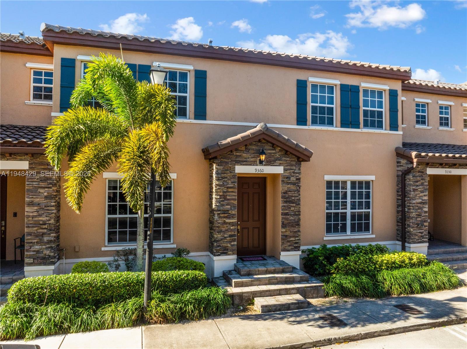 9360 Southwest 171st Court Miami, FL 33196 - Photo 37 of 43 a front view of a house with a yard