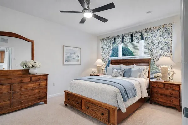 a bedroom with a bed and a dresser
