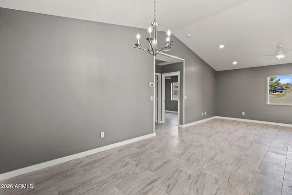 a view of a chandelier in big room and chandelier