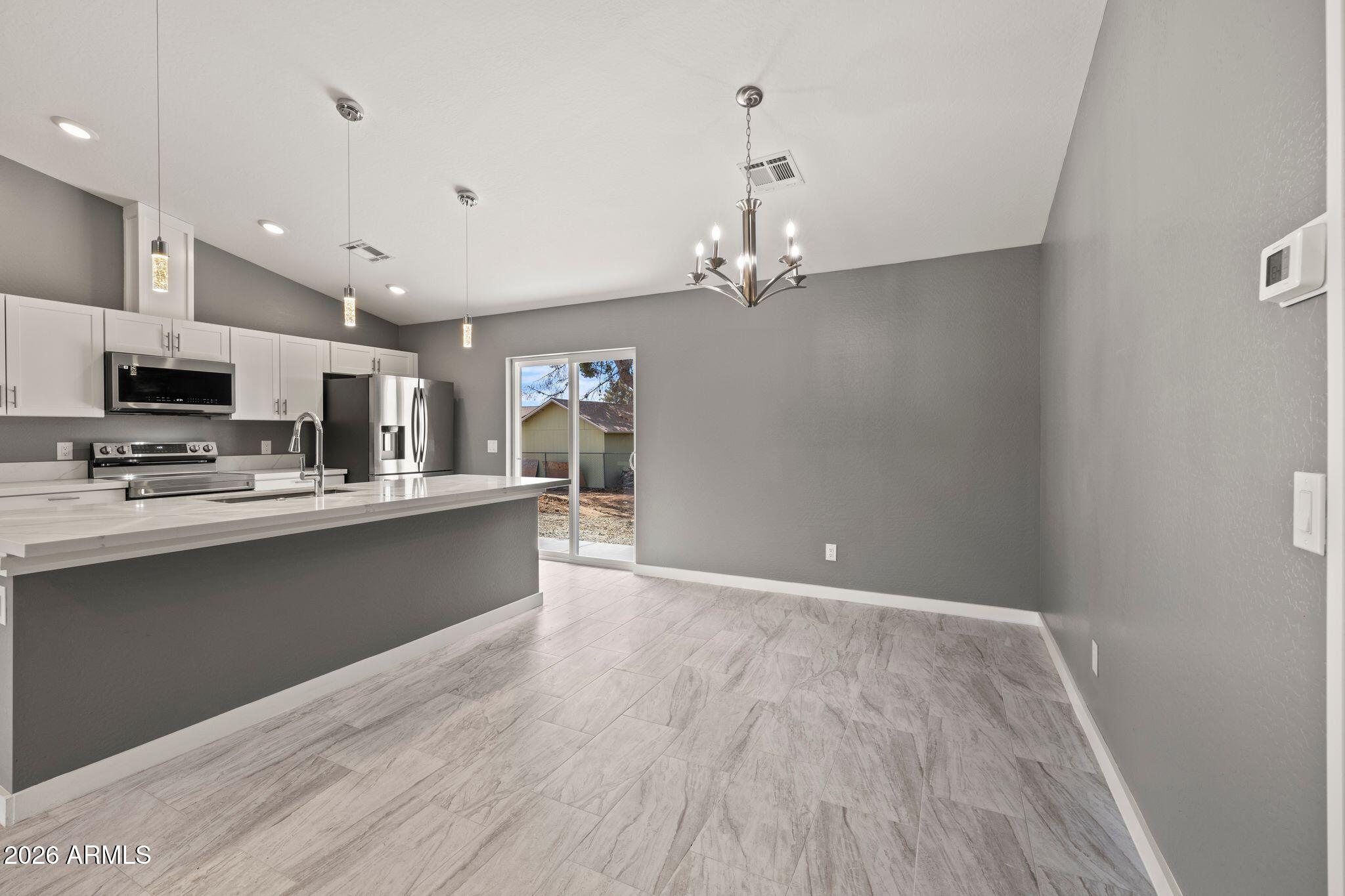17933 East Bob White Road Mayer, AZ 86333 - Photo 18 of 30 a view of a kitchen with a sink and dishwasher a refrigerator with wooden floor