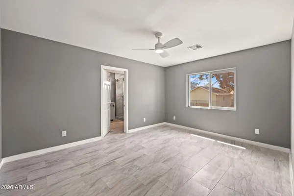 a view of an empty room with a window