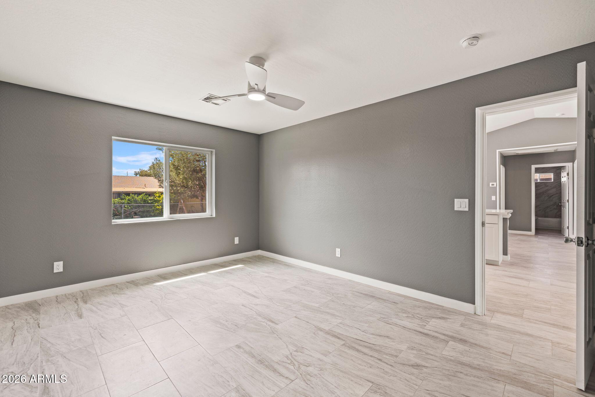 17933 East Bob White Road Mayer, AZ 86333 - Photo 23 of 30 wooden floor in an empty room with a window