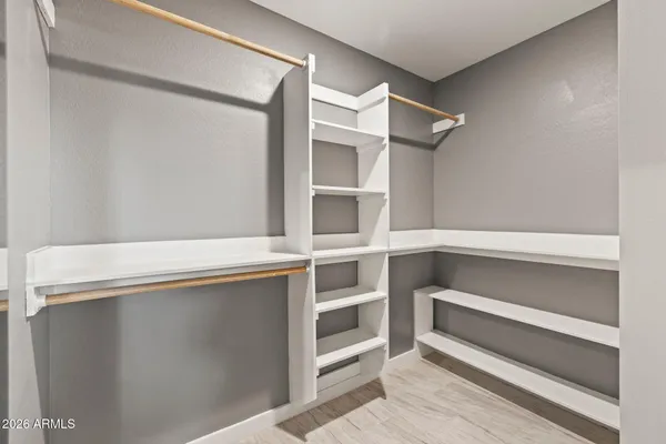 a view of an empty walk in closet