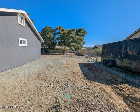 a view of a back yard of the house