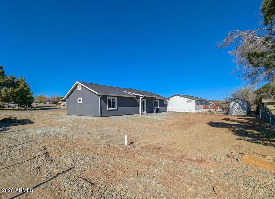 17933 East Bob White Road Mayer, AZ 86333 - Photo 5 of 30 a yellow house with a snow in the background