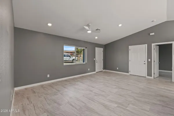 a view of an empty room with a window