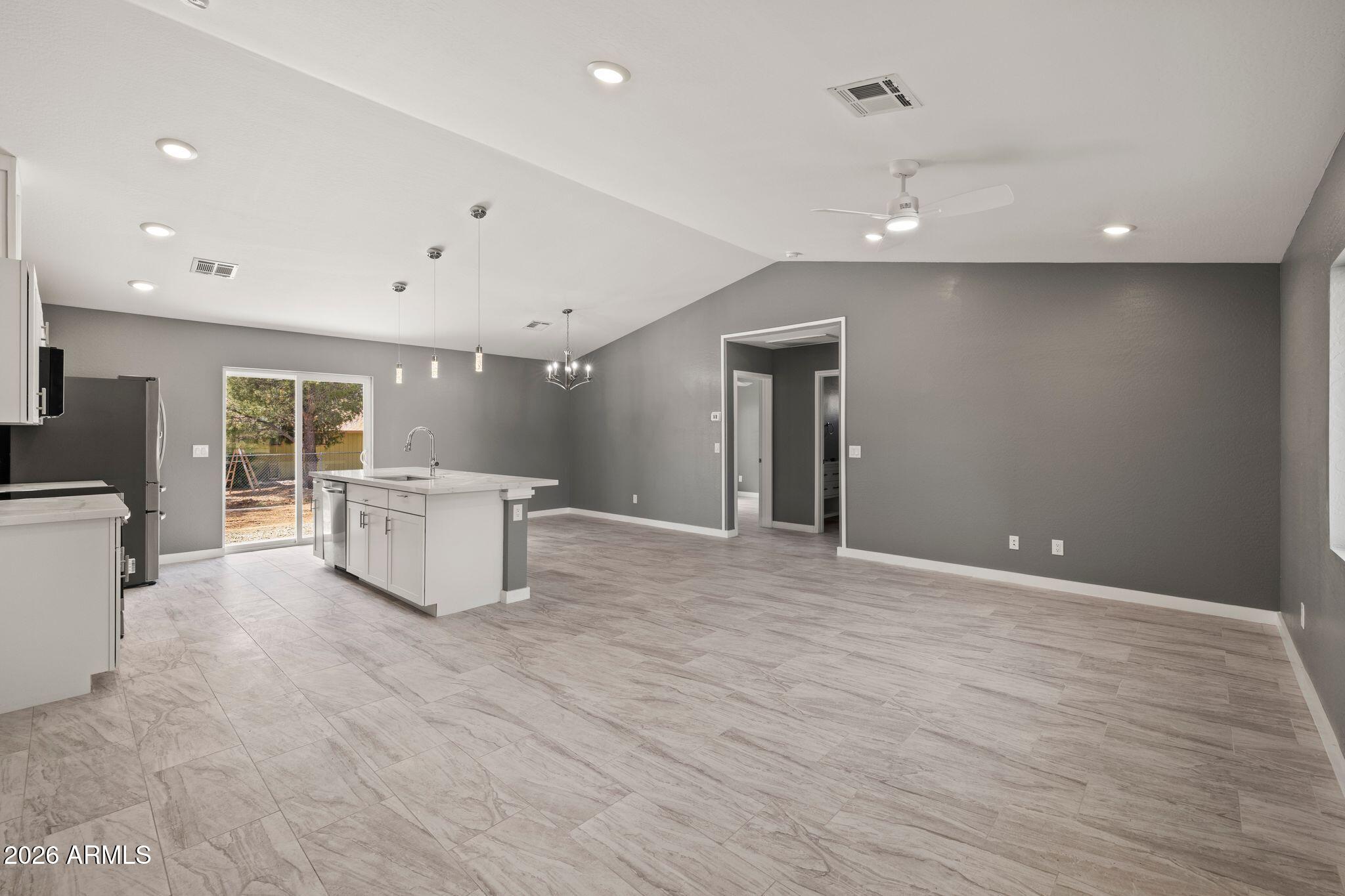 17933 East Bob White Road Mayer, AZ 86333 - Photo 8 of 30 a view of an empty room with window and wooden floor