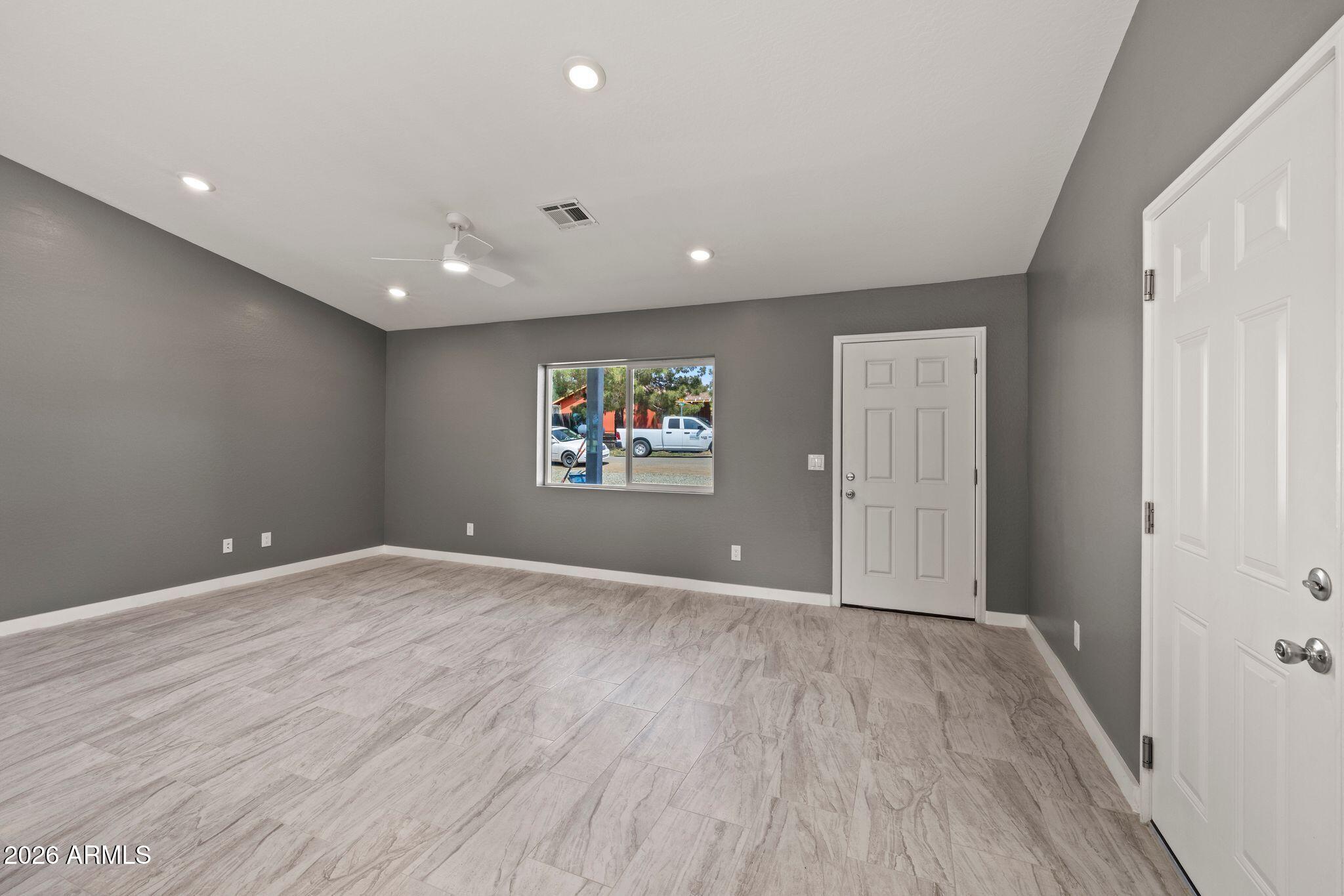 17933 East Bob White Road Mayer, AZ 86333 - Photo 9 of 30 a view of an empty room with wooden floor