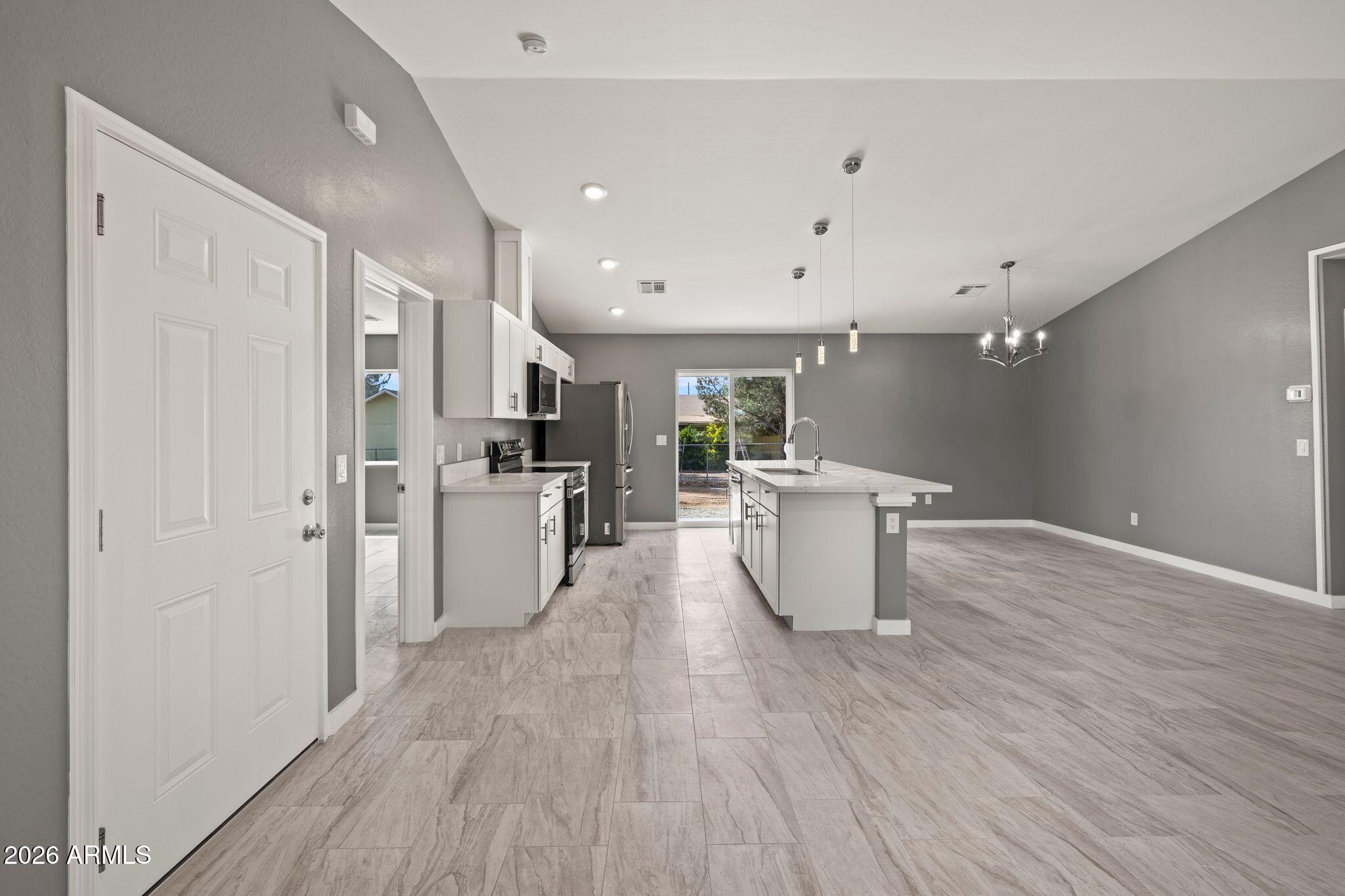 17933 East Bob White Road Mayer, AZ 86333 - Photo 10 of 30 a kitchen with a sink and wooden floor