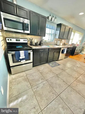 a bathroom with a shower and a sink