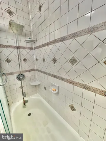 a bedroom with a bed and flat screen tv