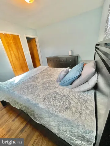 a bathroom with a toilet a sink and a mirror