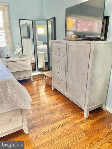 a bathroom with a toilet a sink and a mirror
