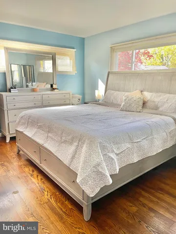 a living room with furniture a window and a table