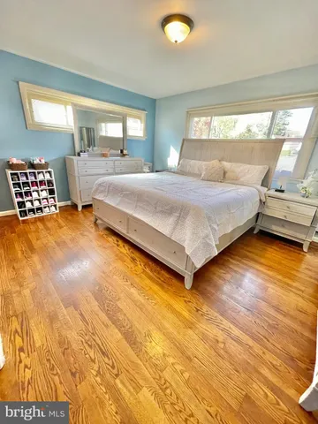 a living room with lots of furniture and a view of kitchen