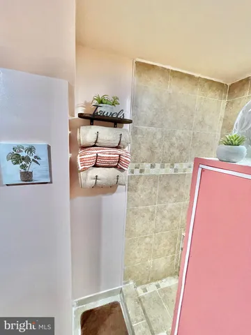 a front view of a house with a garden and yard