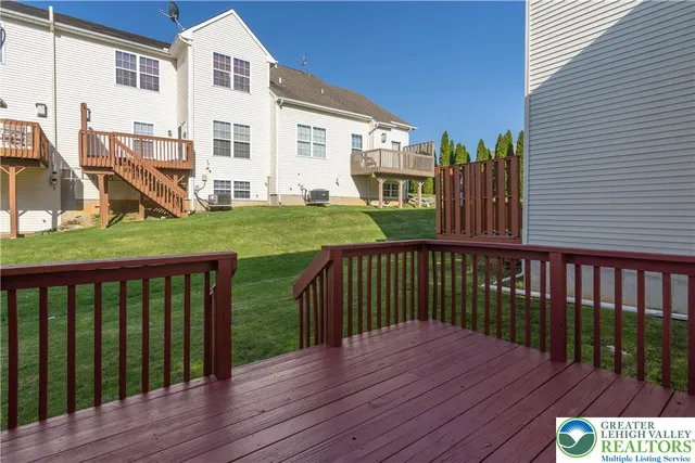 a view of a wooden deck and yard