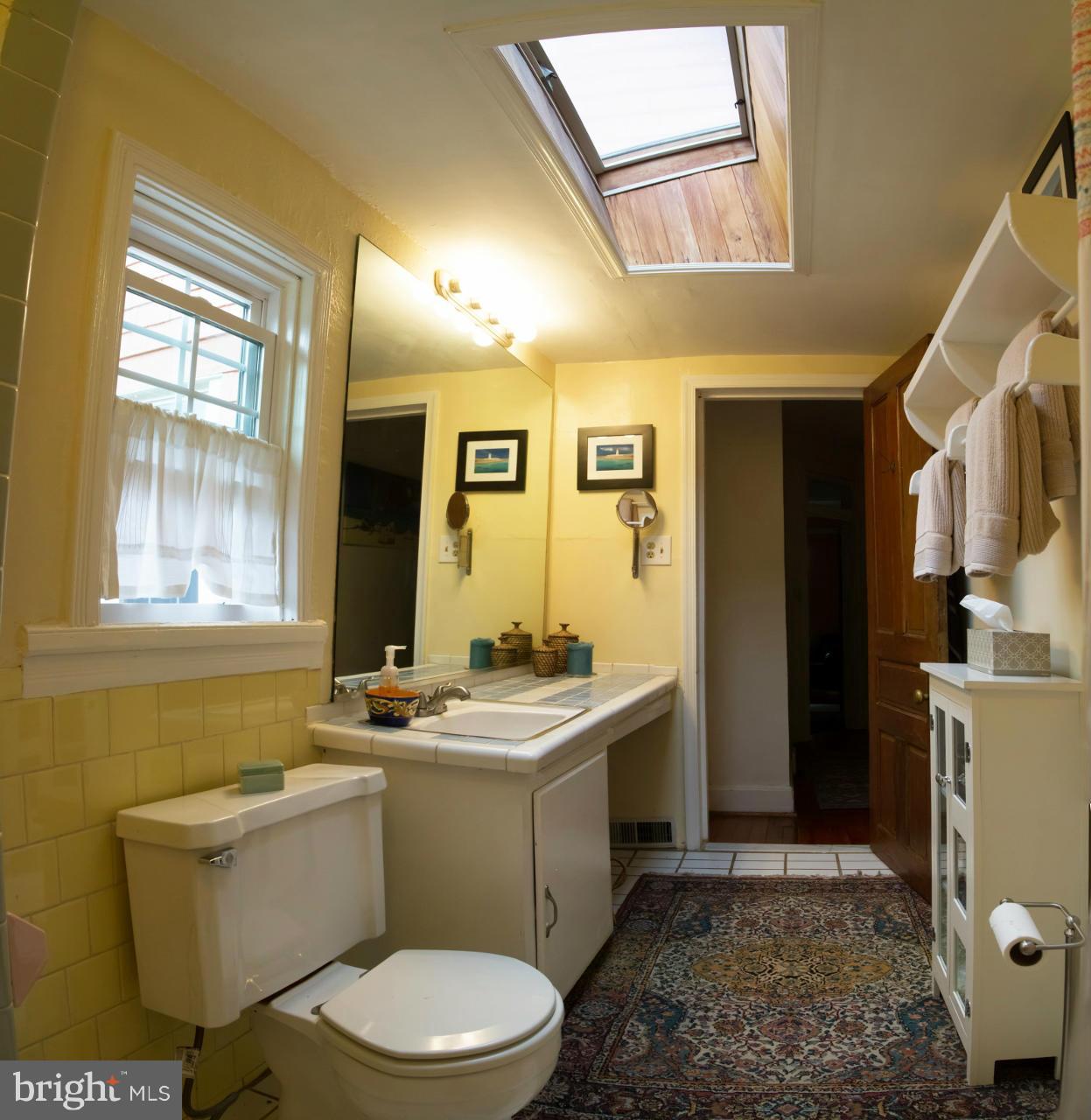 5719 Berwyn Road Berwyn Heights, MD 20740 - Photo 13 of 30 a bathroom with a sink a toilet and mirror