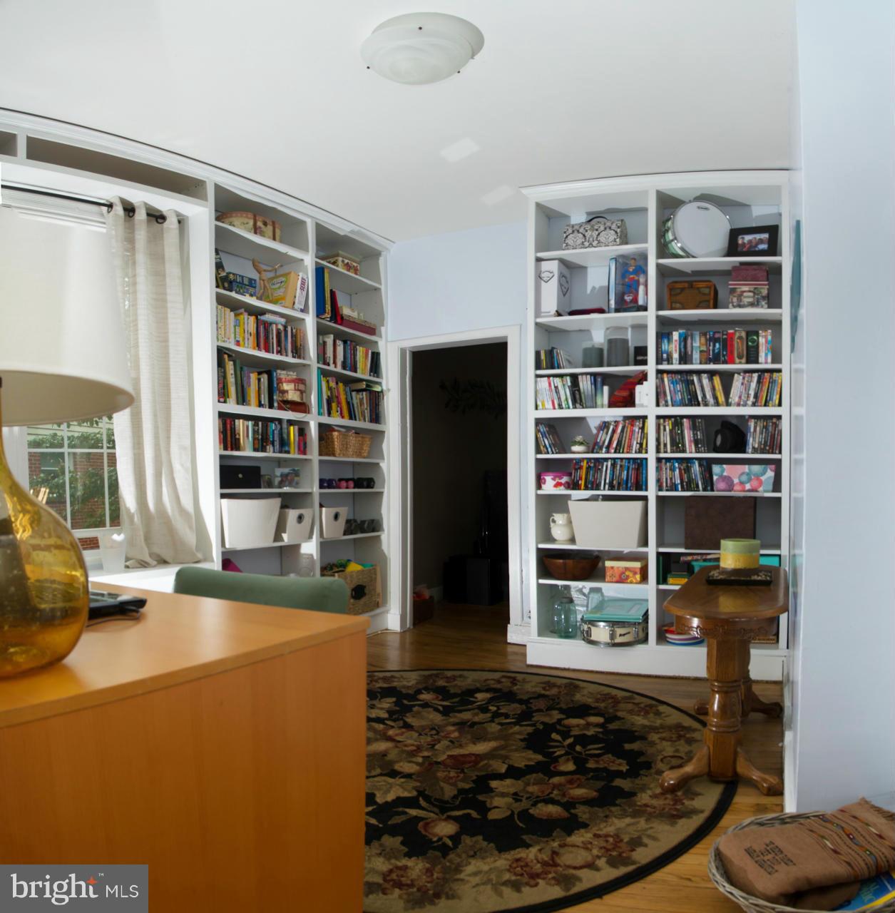 5719 Berwyn Road Berwyn Heights, MD 20740 - Photo 15 of 30 a room with a book shelf and a rug