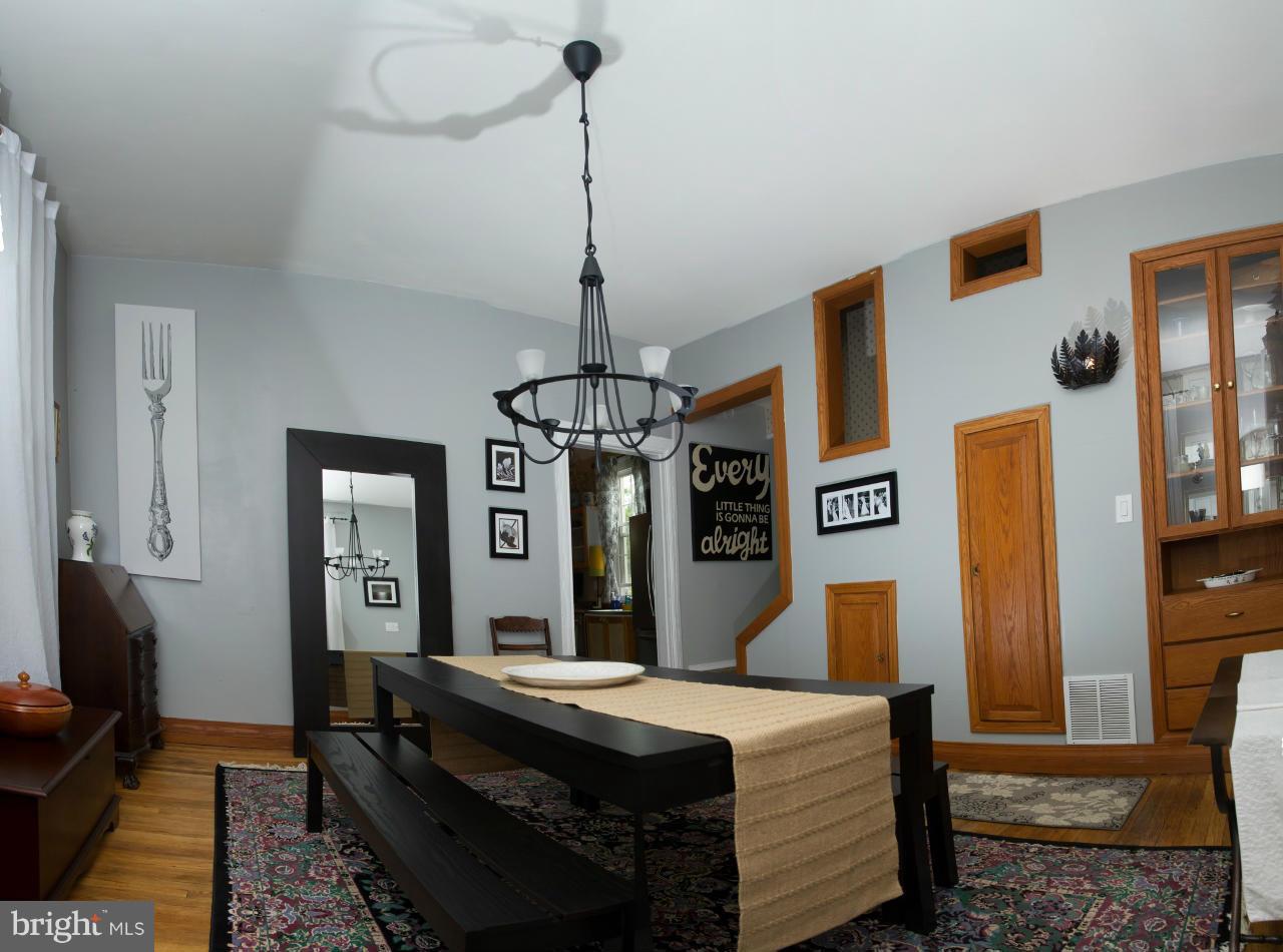 5719 Berwyn Road Berwyn Heights, MD 20740 - Photo 22 of 30 a bed room with a bed and a chandelier