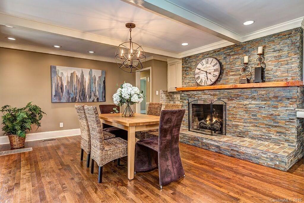 6127 Glenridge Road Charlotte, NC 28211 - Photo 2 of 24 a view of a dining room with furniture window and wooden floor