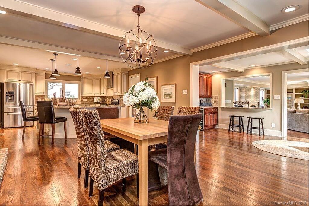 6127 Glenridge Road Charlotte, NC 28211 - Photo 11 of 24 a view of a dining room with furniture and wooden floor