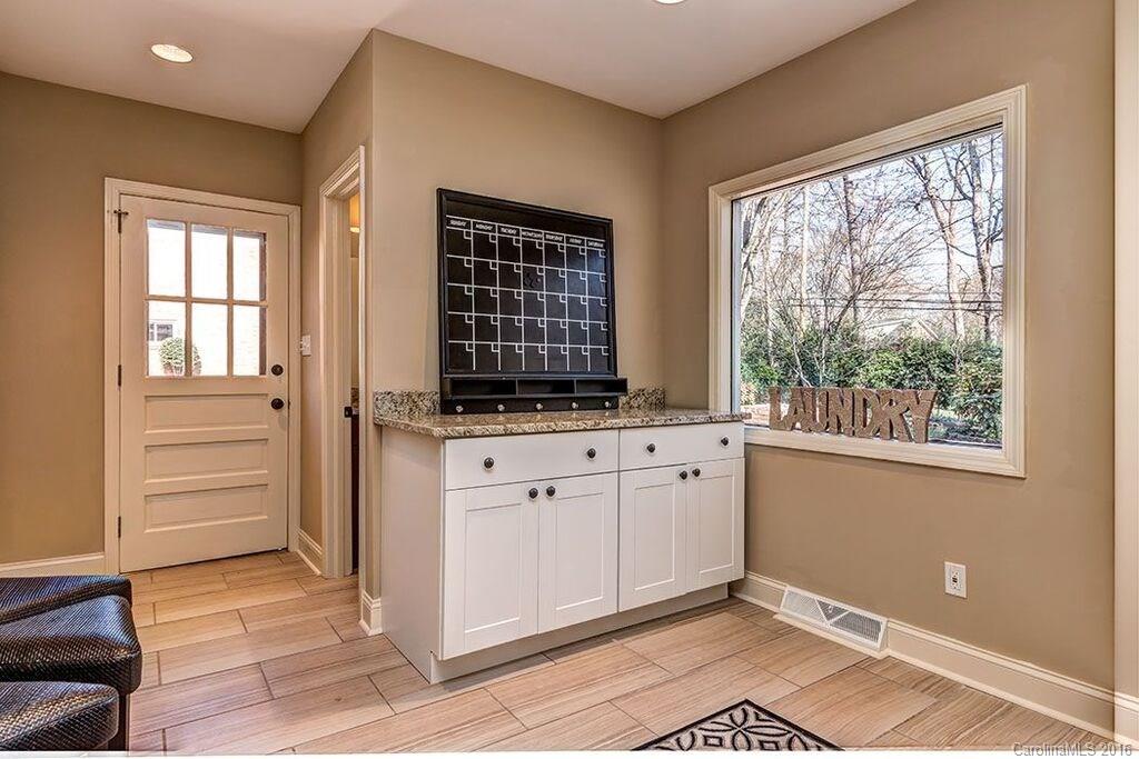 6127 Glenridge Road Charlotte, NC 28211 - Photo 14 of 24 a view of a kitchen with dishwasher cabinet and a window