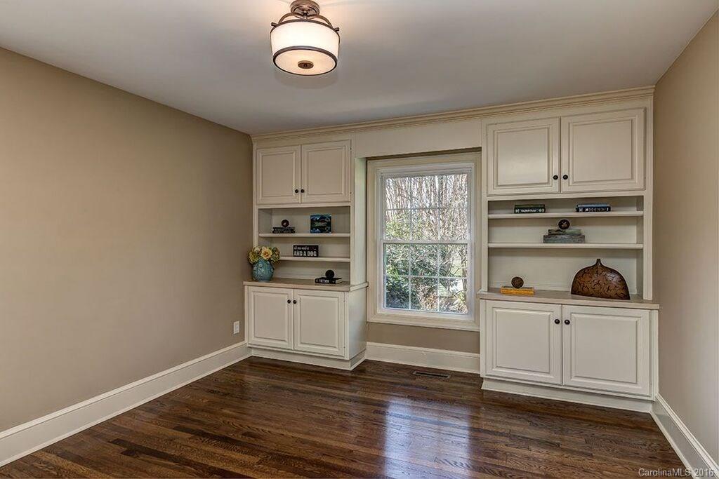 6127 Glenridge Road Charlotte, NC 28211 - Photo 21 of 24 a view of a kitchen with wooden floor and cabinets