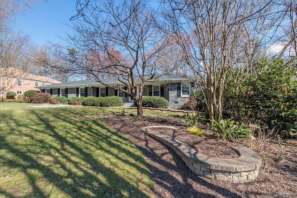 6127 Glenridge Road Charlotte, NC 28211 - Photo 4 of 24 a front view of a house with garden