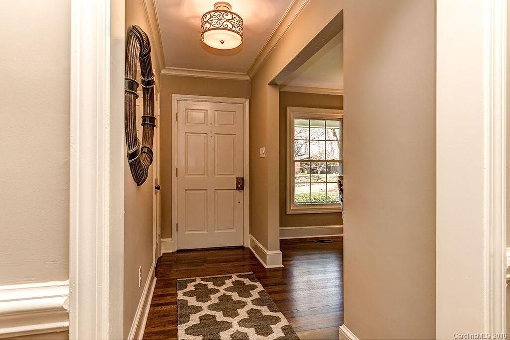 6127 Glenridge Road Charlotte, NC 28211 - Photo 5 of 24 a view of hallway with wooden floor