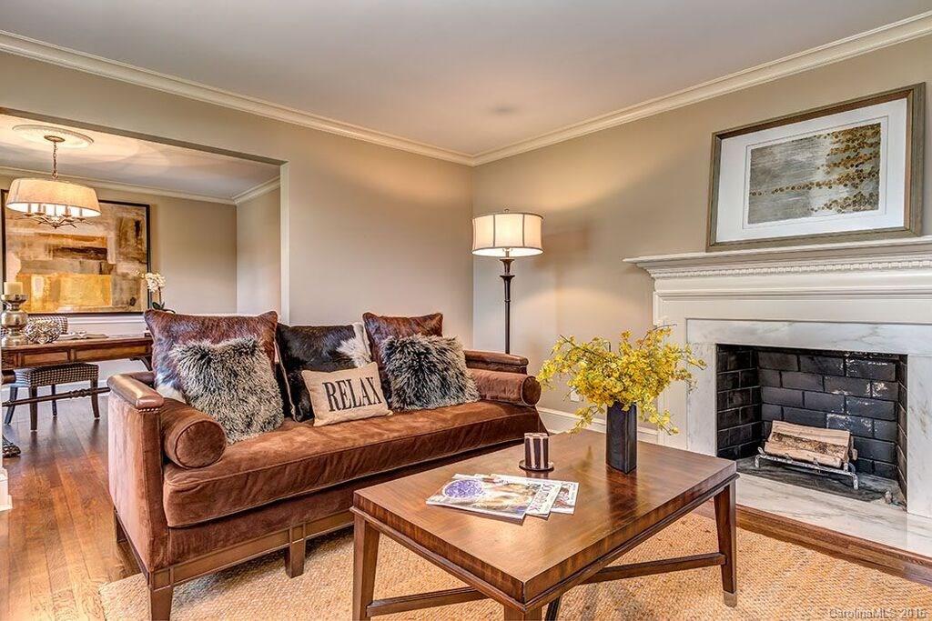 6127 Glenridge Road Charlotte, NC 28211 - Photo 6 of 24 a living room with furniture and a fireplace