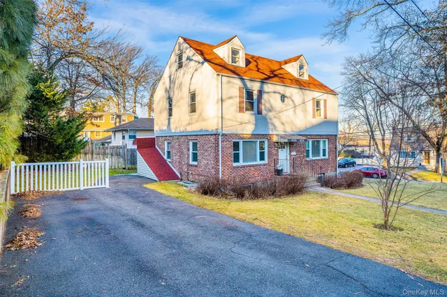 a view of a house with swimming pool and sitting area