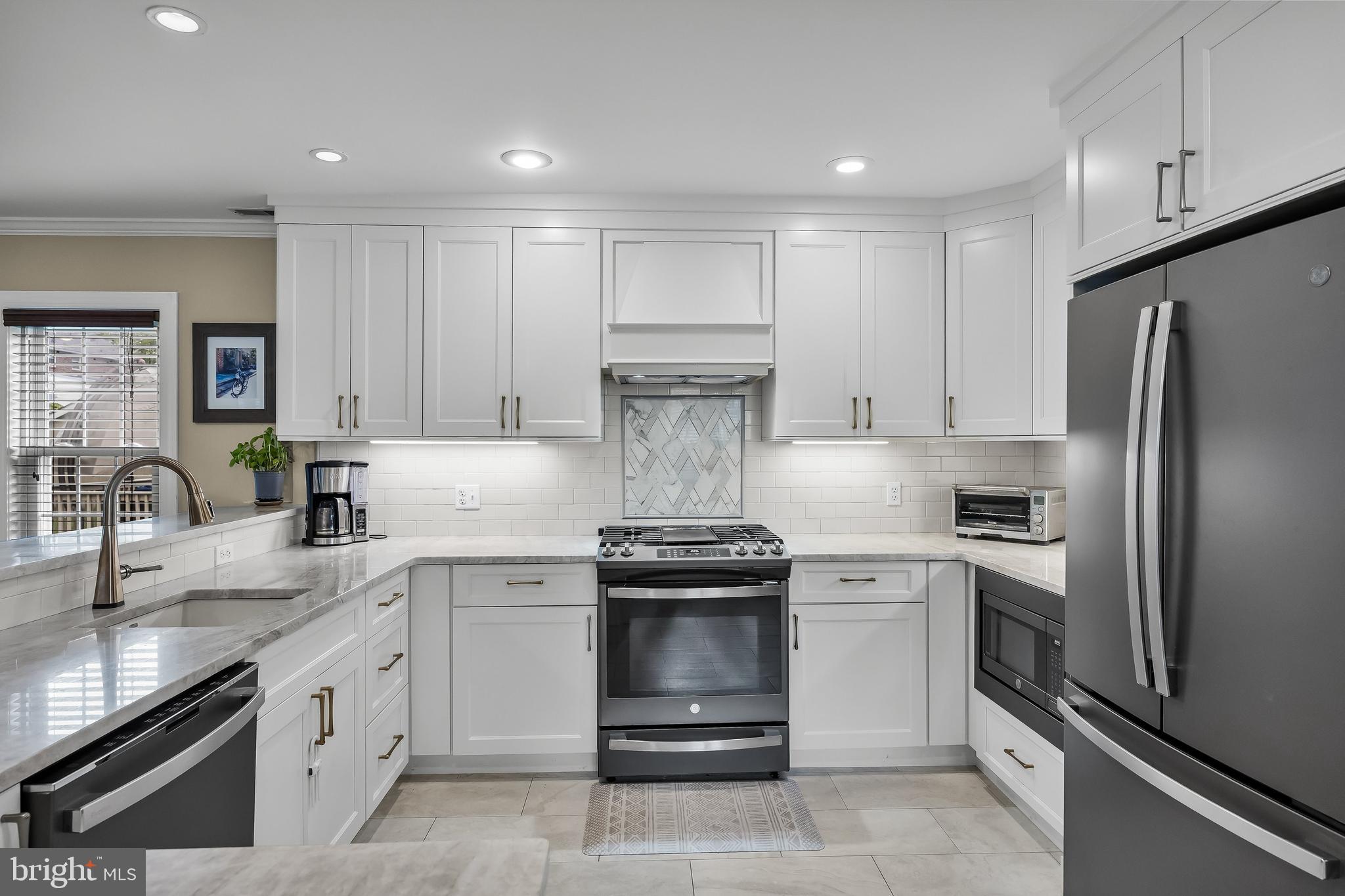 31 Wesley Avenue Cherry Hill, NJ 08002 - Photo 12 of 52 a kitchen with a stove sink and refrigerator